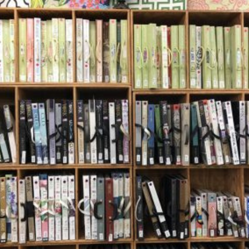 A wall filled with wallpaper samples.