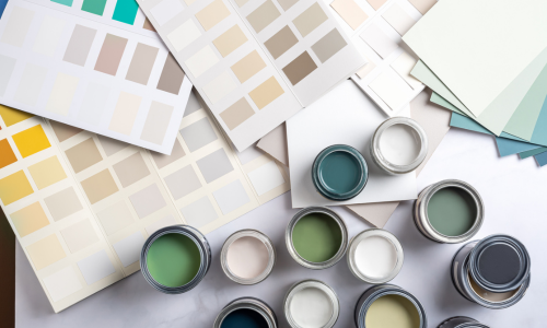 An arial view of open paint cans and swatch samples.